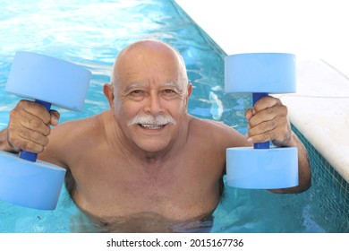 Senior man holding dumbbells in swimming pool - Powered by Shutterstock