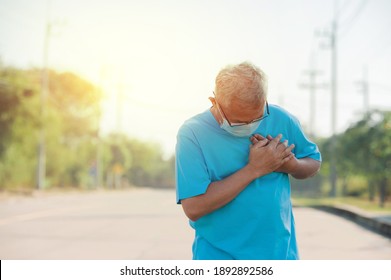 Senior Man Holding Heart Painful In Exercise ,Man Wear Face Mask Protect Coronavirus Covid 19 