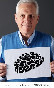 Senior Man Holding Ink Drawing Of Brain