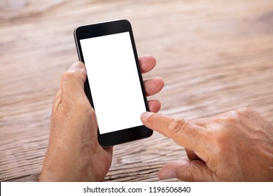 Senior Man Holding Mobile Phone With Blank White Screen