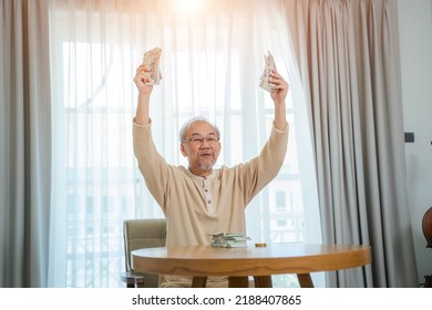 Senior Man Holding Money In Both Hands,Happy Senior Man Celebrating Financial Success.