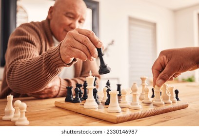 Senior man, home and chess for games, competition and focus with friends, strategy and problem solving. Elderly person, hands and board for contest with mindset, excited smile and moving at table - Powered by Shutterstock