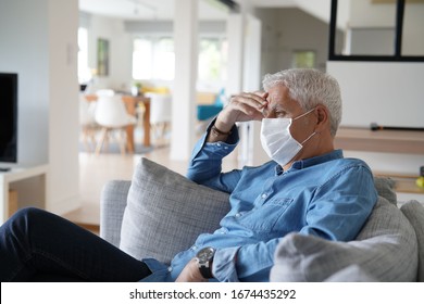 Senior Man At Home Wearing Protection Mask