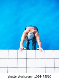 Senior Man In An Indoor Swimming Pool.