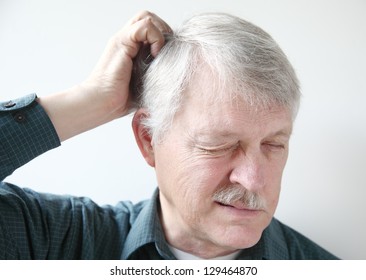 Senior Man With Itchy Scalp