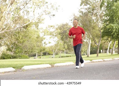 Senior Man Jogging In Park