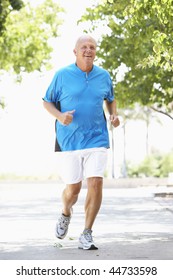 Senior Man Jogging In Park