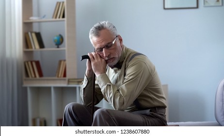 Senior Man Leaning On Walking Stick, Taking Nap, Afternoon Sleep Good For Health