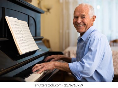 Senior Man Learning To Play Piano