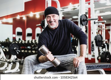 Senior Man Lifting His Weight In The Gym