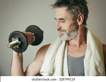 Senior Man Lifting Weights 