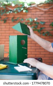 Senior Man Making A Birdhouse