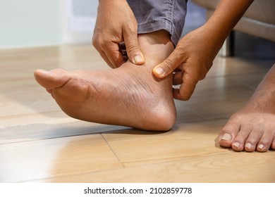 Senior Man Massage Foot With Painful Swollen Gout Inflammation