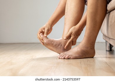 Senior Man Massage Foot With Painful Swollen Gout Inflammation