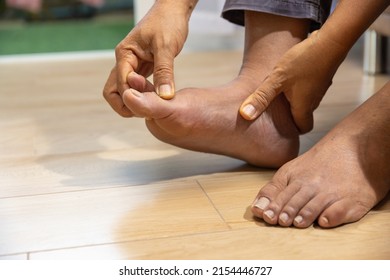 Senior Man Massage Foot With Painful Swollen Gout Inflammation