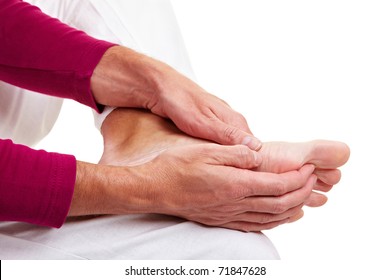 Senior Man Massaging His Aching Feet With His Hands