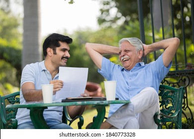 Senior Man Meeting With Their Financial Advisor 