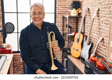 Senior Man Musician Holding Trumpet At Music Studio