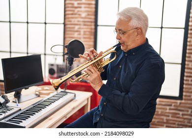 Senior Man Musician Playing Trumpet At Music Studio