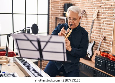 Senior Man Musician Playing Trumpet At Music Studio