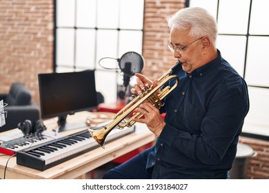 Senior Man Musician Playing Trumpet At Music Studio