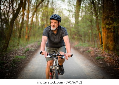 Senior man on his mountain bike outdoors (shallow DOF; color toned image) - Powered by Shutterstock