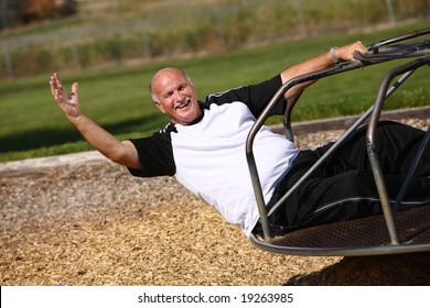 Senior Man On Merry Go Round