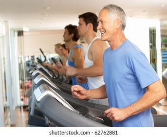 Senior Man On Running Machine In Gym - Powered by Shutterstock