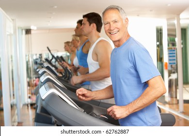 Senior Man On Running Machine In Gym