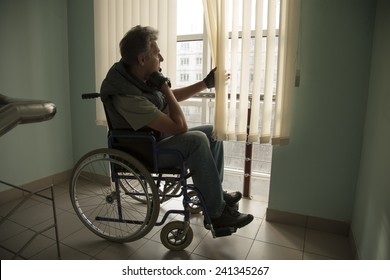 senior man on wheelchair in hospital