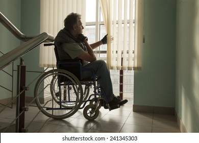 Senior Man On Wheelchair In Hospital