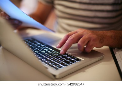 Senior Man Paying Bills Online On Laptop.