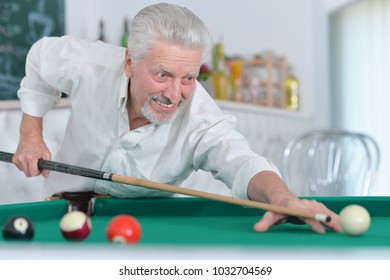 Senior Man Playing Billiard  