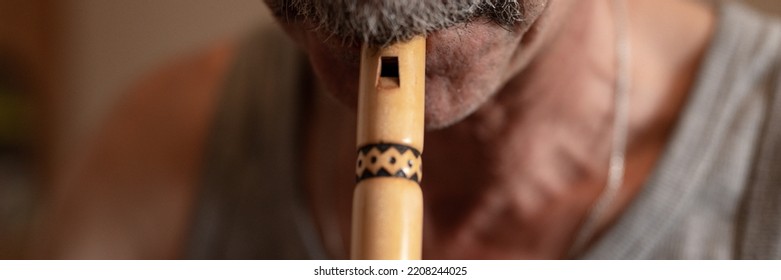 Senior Man Playing Flute. Faceless Unprofessional Male Elderly Caucasian Recorder People With A Moustache With Mouth And Lips Play On Pipe Amateur Music Close Up At Home. Hobbies And Leisure. Banner