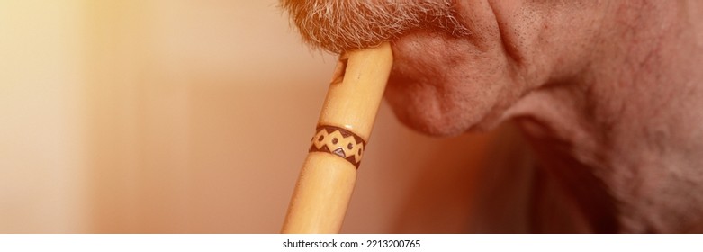 Senior Man Playing Flute. Faceless Unprofessional Male Elderly Caucasian Recorder People With Moustache With Mouth And Lips Play On Pipe Amateur Music Close Up Home. Hobbies And Leisure. Banner. Flare