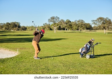 senior man playing golf ready to hit the ball - Shutterstock ID 2256925535