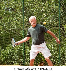 Senior Man Playing Tennis