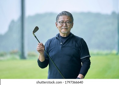 Senior man practicing on a golf course