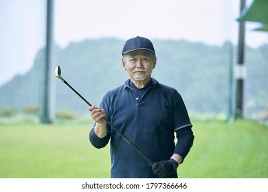 Senior man practicing on a golf course - Powered by Shutterstock