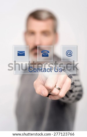Senior man pressing contact button on virtual screen
