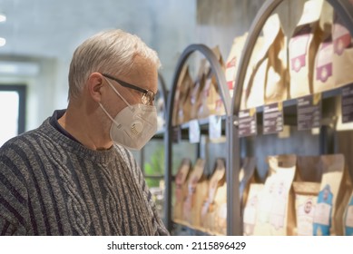 Senior Man In Protective Face Mask Shopping At Coffee Shop During Pandemic. New Normal Retail Shopping