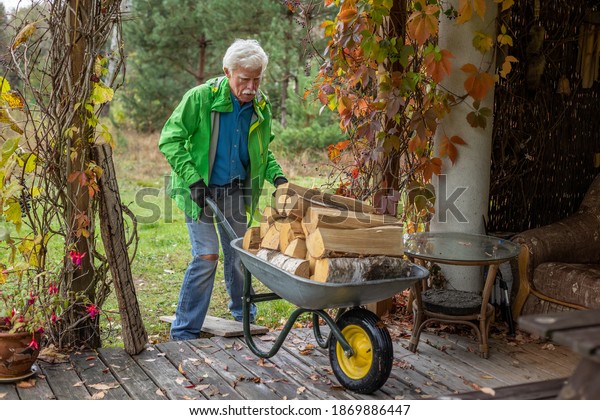 Senior Man Pushing Wheelbarrow Full Heavy Stock Photo 1869886447 