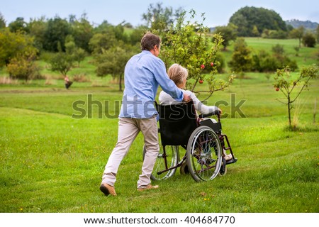 Similar – Granddaughter running to grandmother in wheelchair