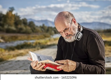 Senior Man Reading A Book