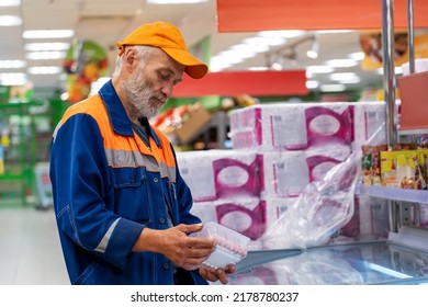 Senior Man Reading Food Label Product At The Supermarket. Mature Man Buying Groceries In Food Store