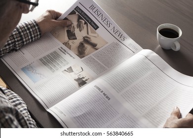 Senior Man Reading Newspaper On Table