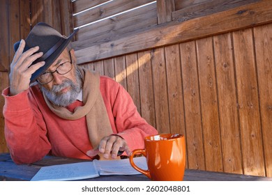 Senior man reading at table 