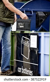 A Senior Man Recycling A Car Battery, Close-up