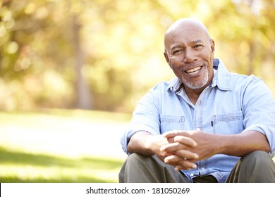 Senior Man Relaxing In Autumn Landscape