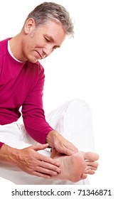 Senior Man Relaxing His Feet With A Massage